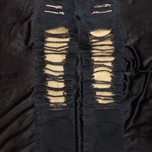 Jeans with gold rippled pattern